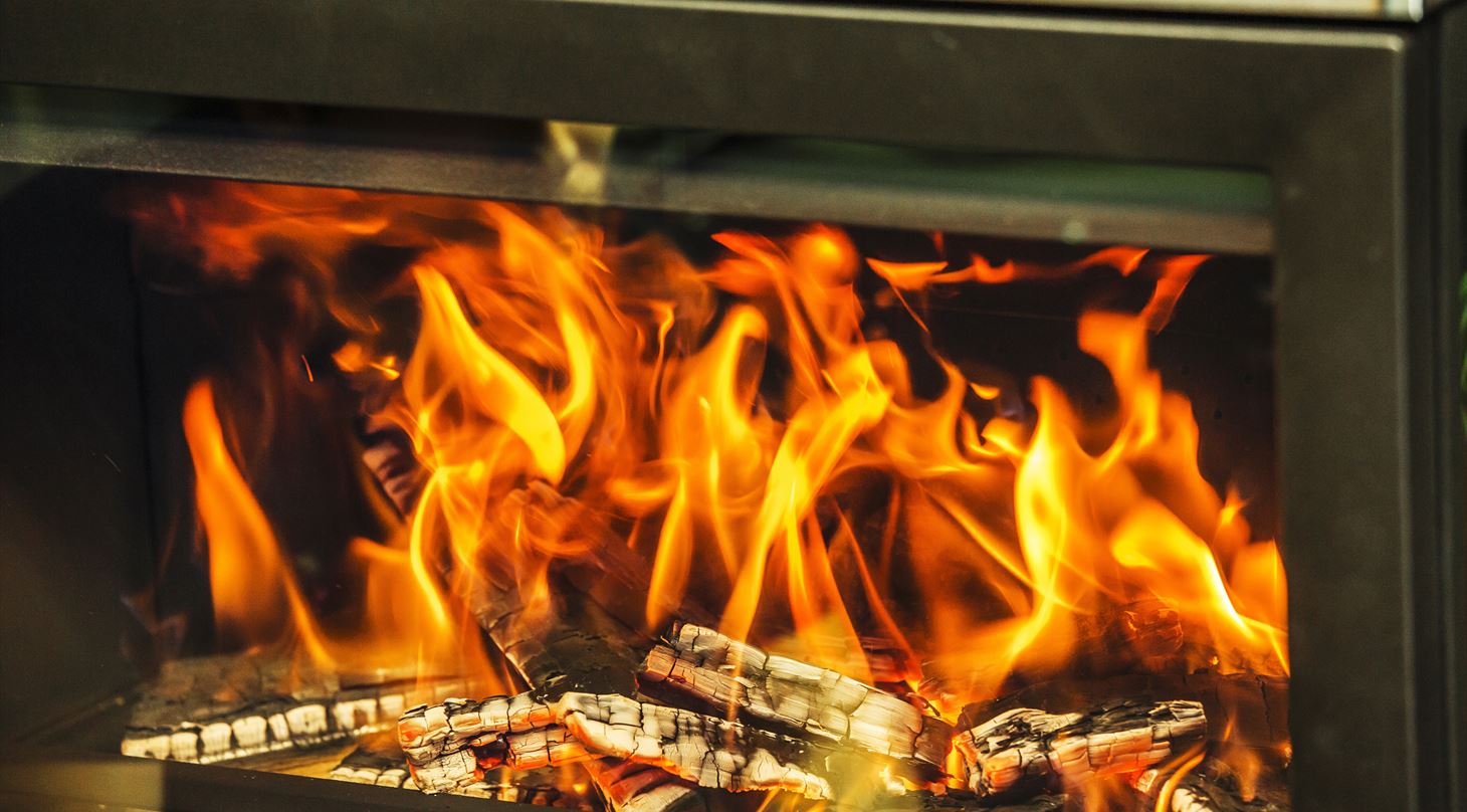 Fire in a wood-burning stove illustrating particulate emissions